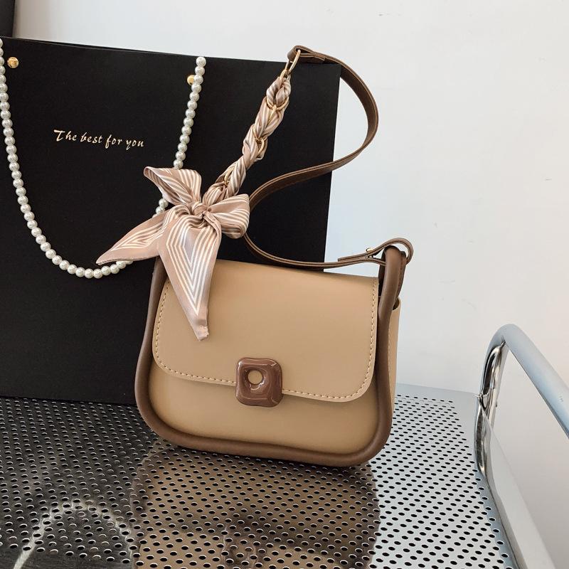 

Today s popular small bags are women s spring new shoulder messenger bags, simple women s contrasting color underarm small square bags.