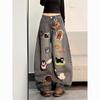 Jeans blu stile cartoon retro americano con graffiti, design primaverile da donna, senso di design, di nicchia, larghi e sottili, dritti, a gamba larga