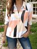 Women's casual shirts feature geometric color blocks arranged in an interlaced pattern, with black, brown, and white forming an abstract print