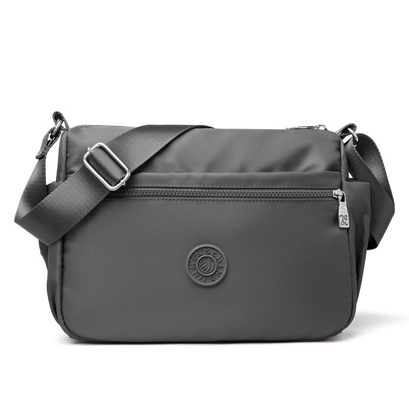 Водостойкая сумка кроссбоди для женщин – Легкая и стильная наплечная сумка с несколькими карманами и регулируемым ремешком серый