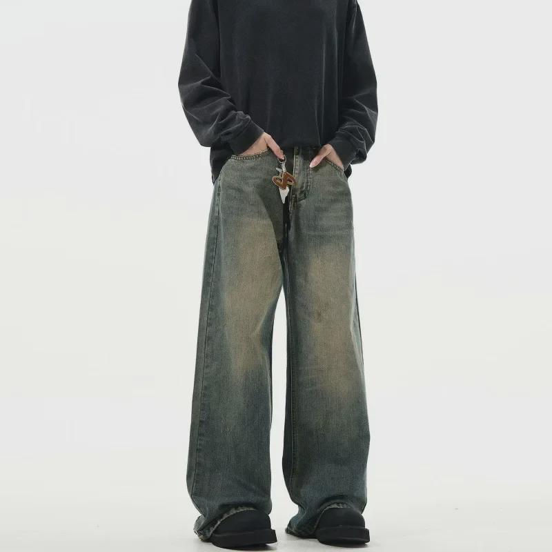 "Autumn Retro Men's Yellow Mud-Dyed Wide-Leg Jeans: American Brand, Loose Fit, Washed & Distressed."