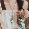 Retro Ethnic Leather Rope Necklace with Pine Cone Flower and Geometric Design - High-End, Personalized Sweater Chain for Women