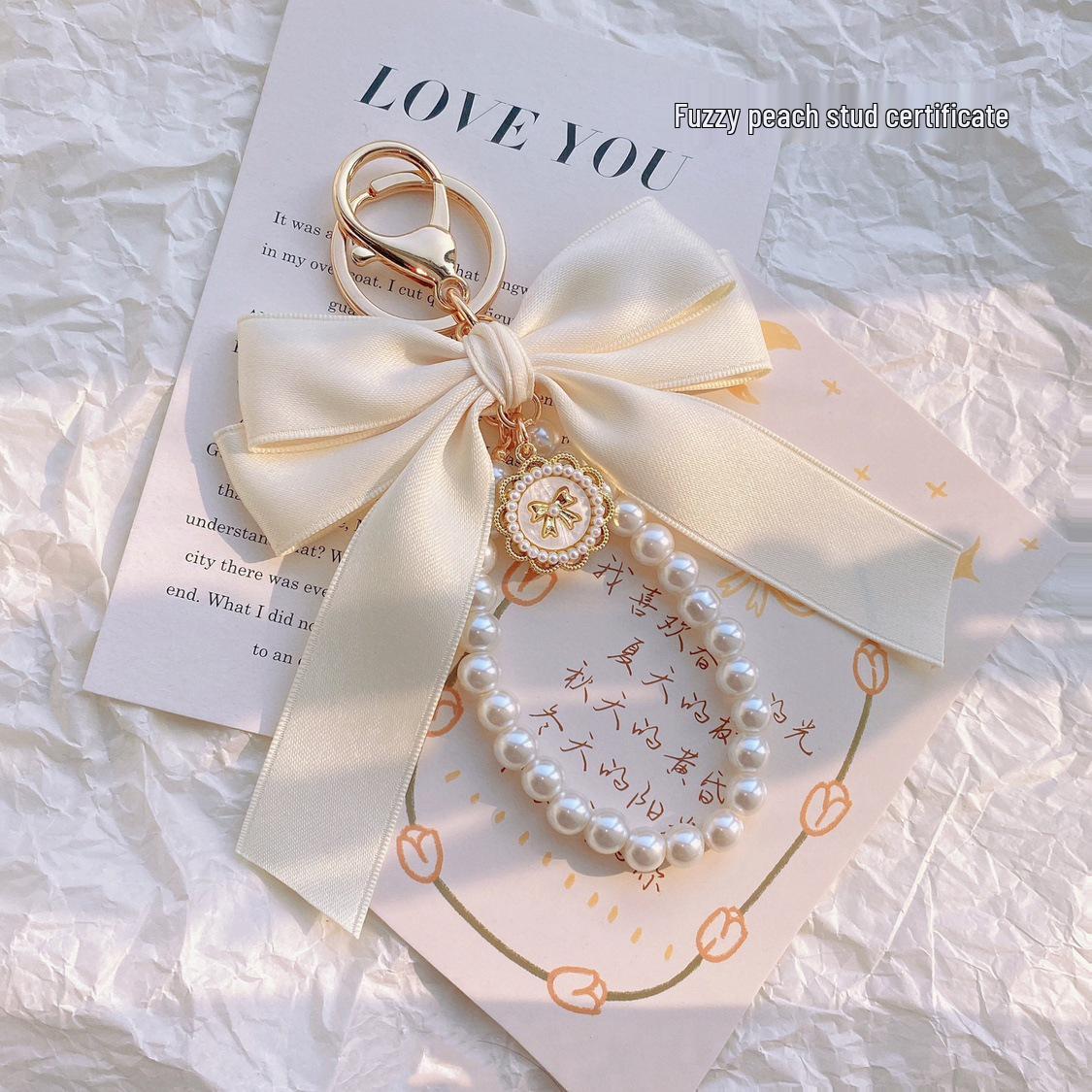 

Матовый жемчужный брелок-подвеска с бантом для девочек