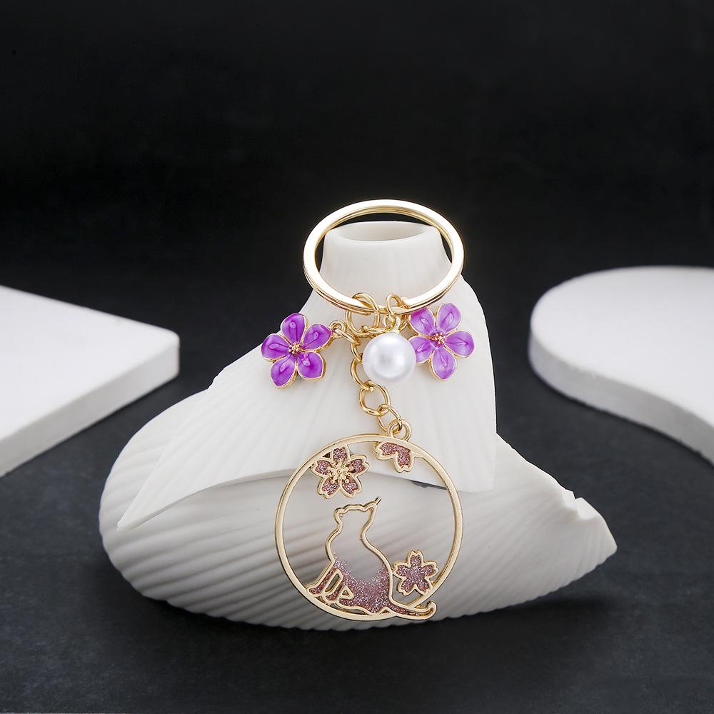 Purple Cherry Blossom Pearl Cat Keychain with Drip Oil Finish