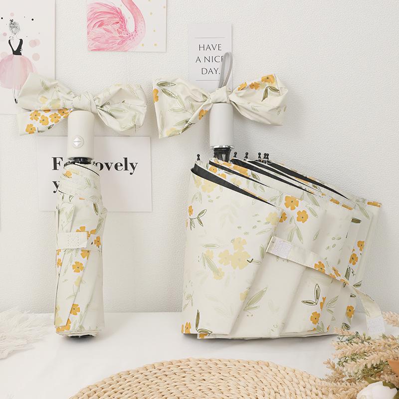 Compact Dual-Purpose Umbrella, UV Protection Parasol with Black Coating, Yellow Floral Design for Sun and Rain