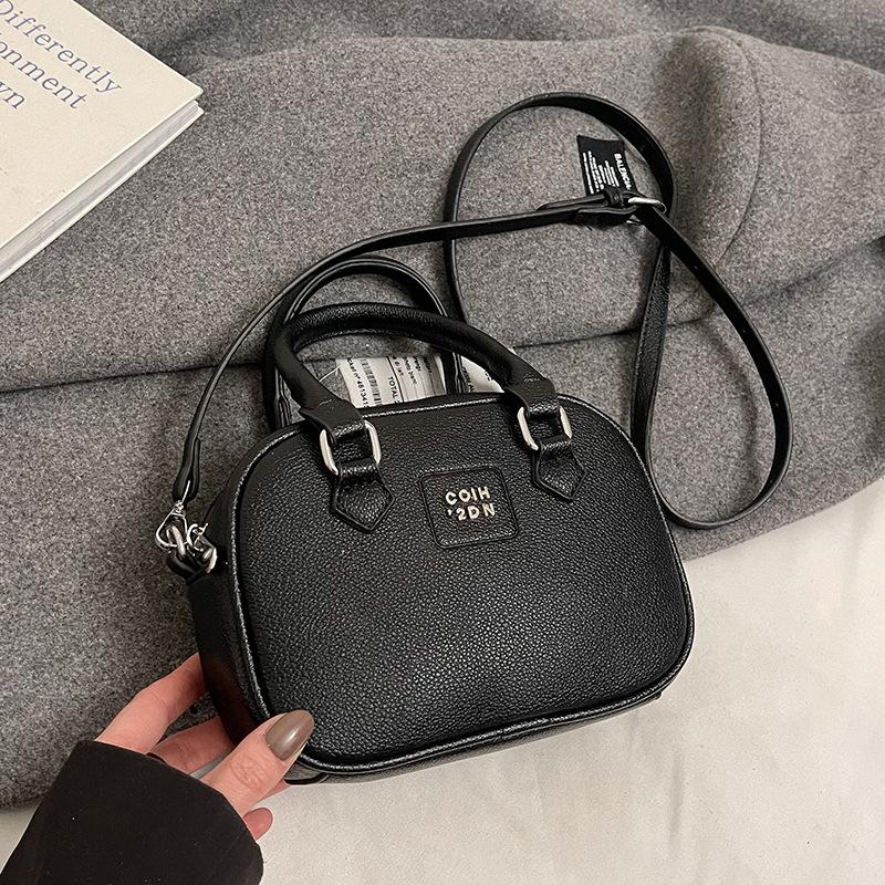Early Spring Hot Sale French Niche Fashionable Portable Bowling Bag Solid Color Versatile Temperament Advanced Sense Messenger Women's Bag