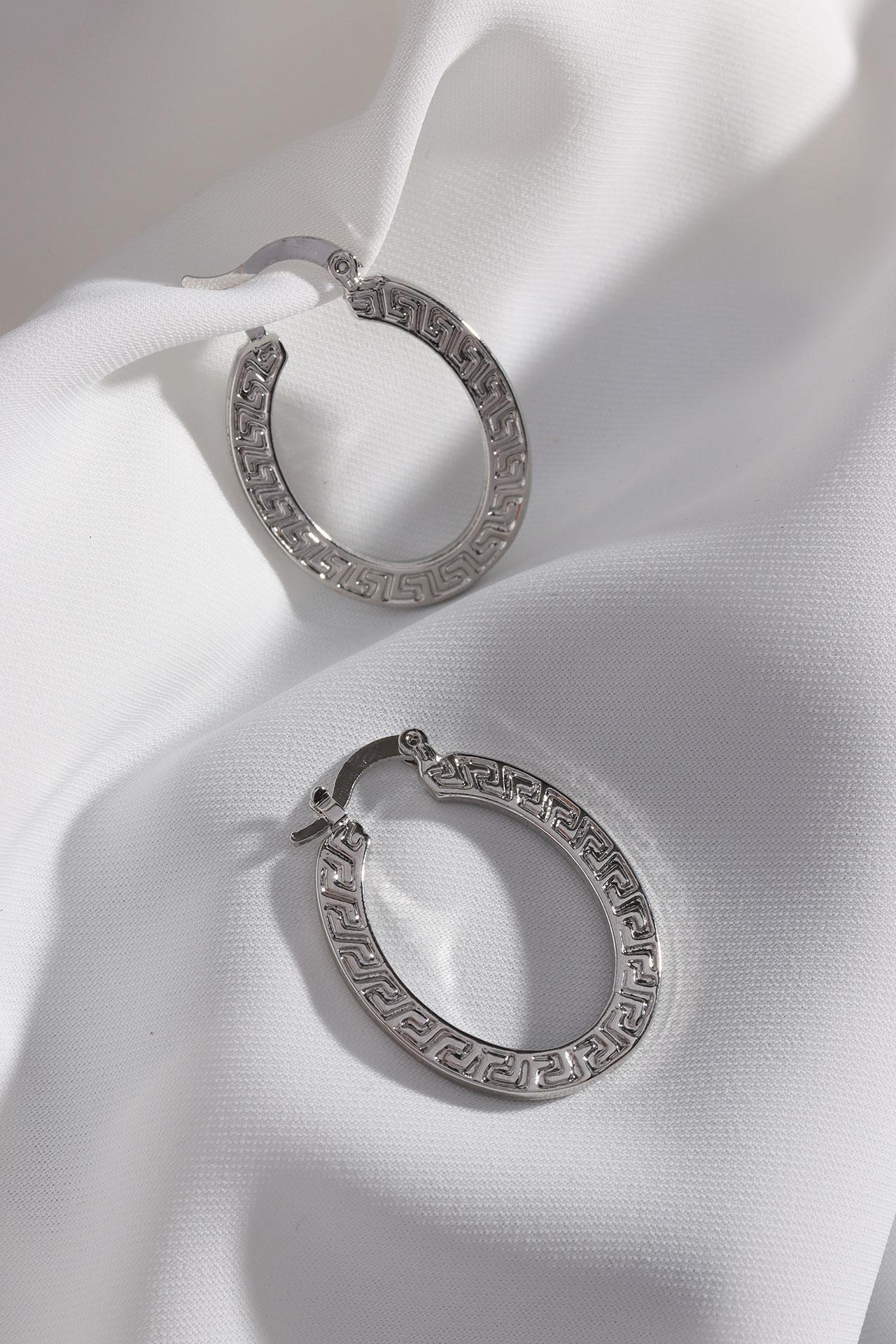 

Винтажные серьги-кольца овальной формы серебряного цвета с рисунком