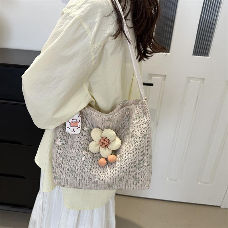 Niche Knitted Bucket Bag New Style Class Commuter Tote Bag for Women Large Capacity Vacation One Shoulder Straw Woven Bag