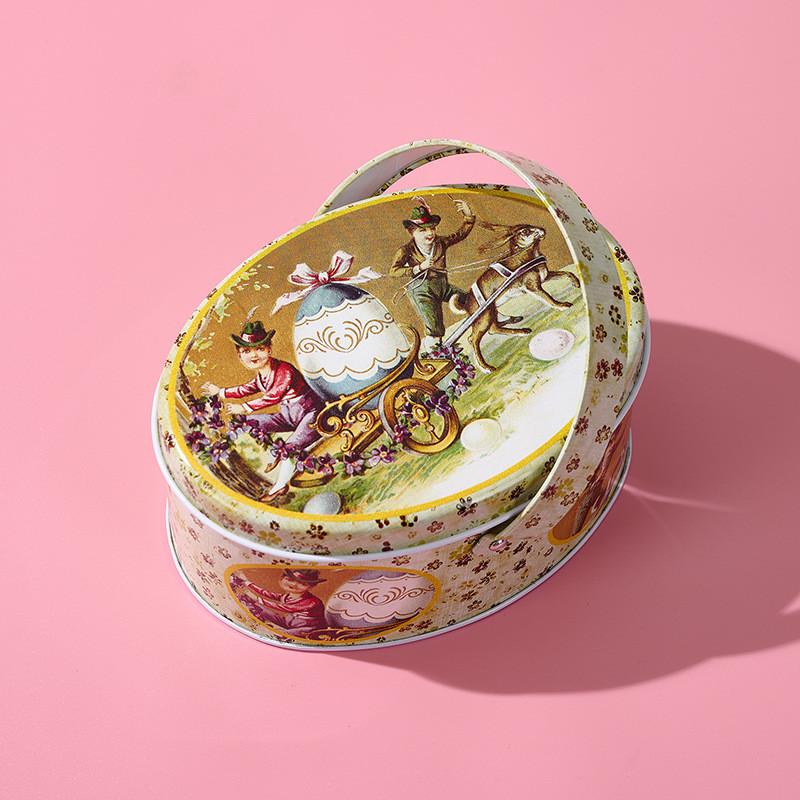 Oval Whimsical Easter Handheld Iron Box With Cheerful Rabbit And Egg Pattern Ideal For Childrens Gifts