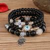 Bohemian Multi-layer Beaded Bracelet with Cross, Evil Eye, Palm Pendants, and Crystals.