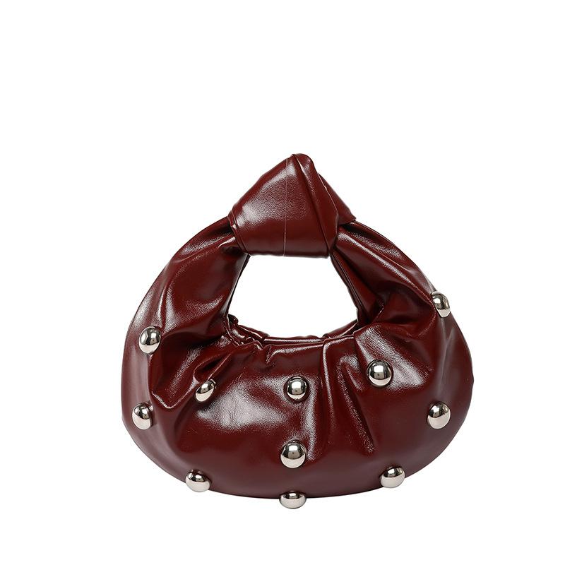 Internet celebrity armpit bag 2025 new Korean version fashion rivet shoulder bag women's versatile pearl hand carrying dumpling bag tide