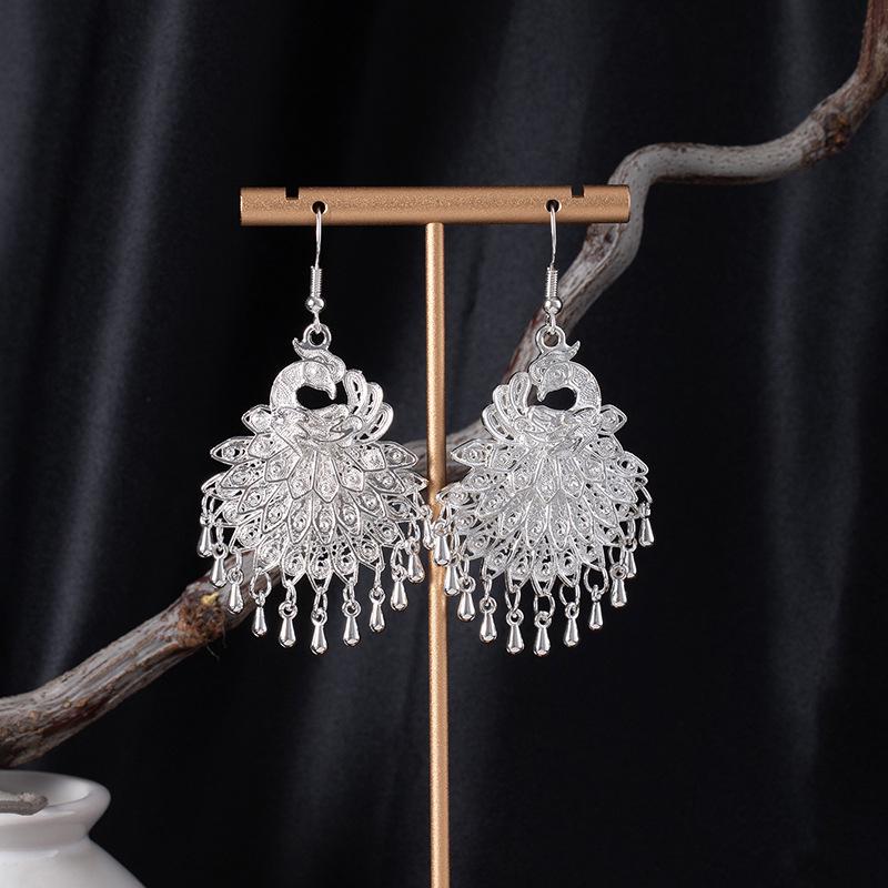 Bohemian Ethnic Miao Silver Tassel Earrings with Butterfly, Peacock, and Flower Design for Women – Long Dangle Jewelry for Travel Photos.