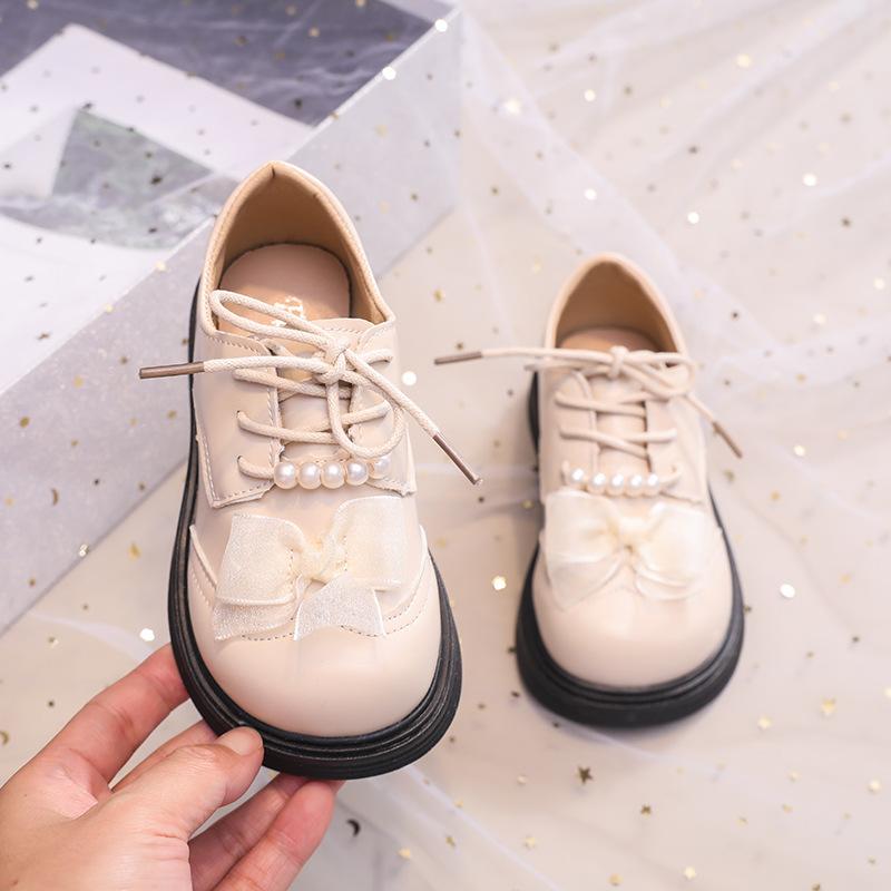 

Кожаная обувь для девочек 2025 ранняя весна новая детская обувь принцессы в британском стиле однотонный бант жемчуг мягкая подошва туфли 26-30 yards FCL shot 50 pairs