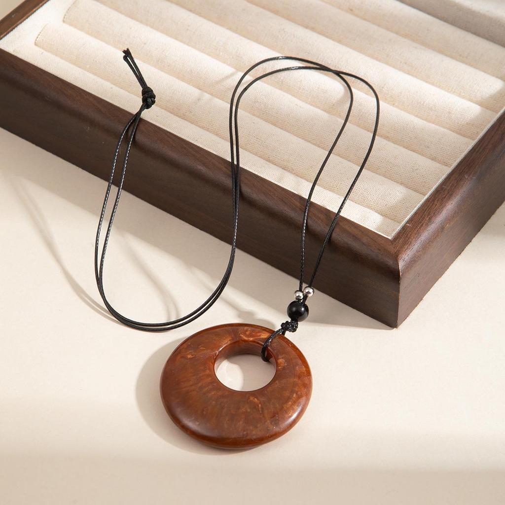 Antique Bronze Feather Necklace: Bohemian Double-Layer Zen Style for Women