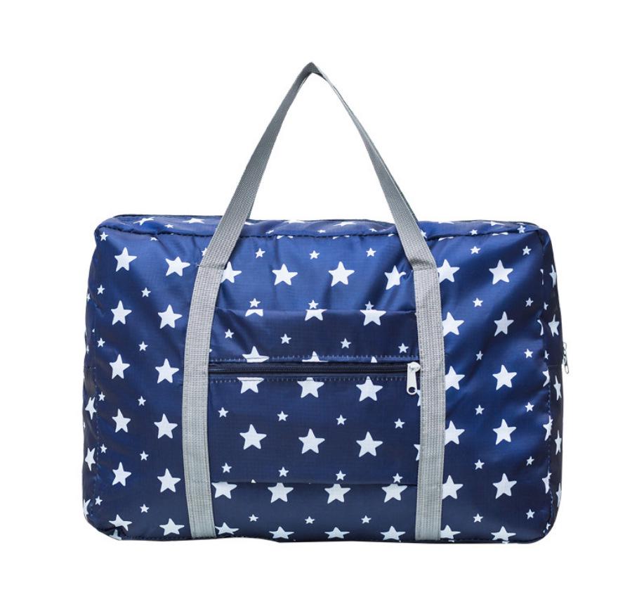 Compact travel bag: suitcase-compatible, hand-held, features an external pocket, handle slip-over design, with matching accessory bag.