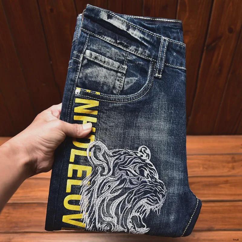 Men's Slim-Fit Embroidered Floral Distressed Jeans with Patches and Elastic Trim.