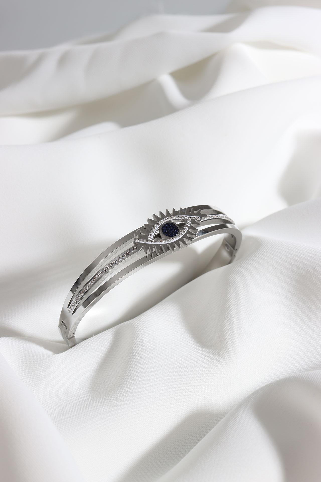 

Стальной браслет-наручники серебряного цвета с рисунком глаза