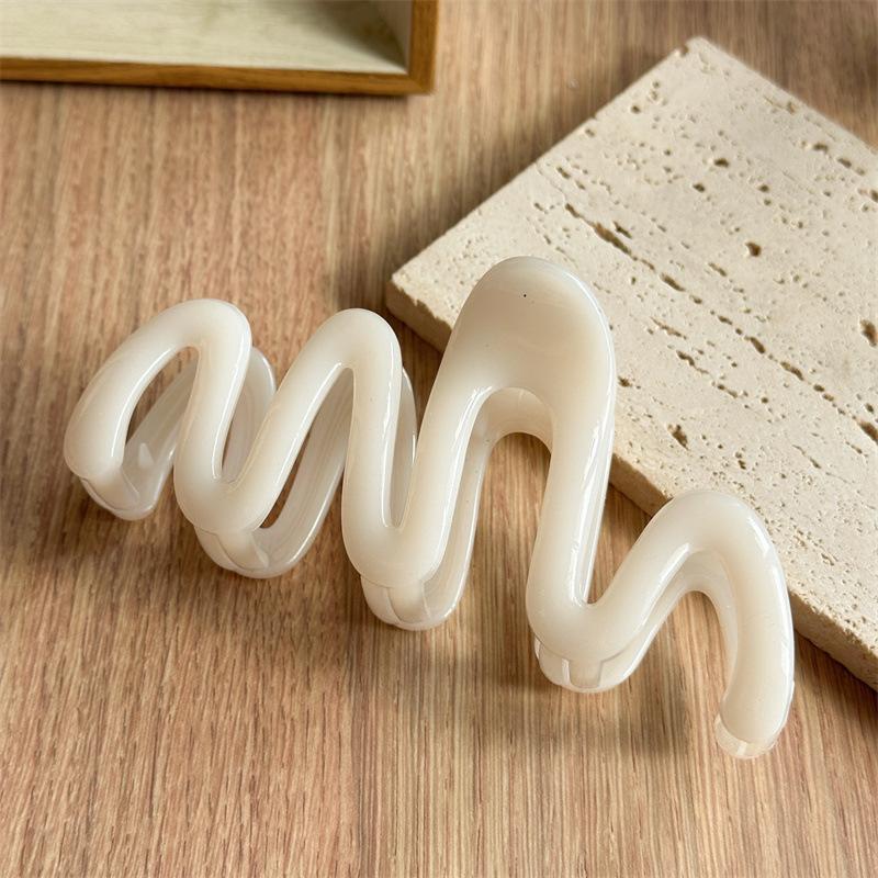Fluid Wave Silhouette Hair Clip In Dreamy Translucent Hues Provides Secure Hold For Messy Buns And Modern Minimalist Updos