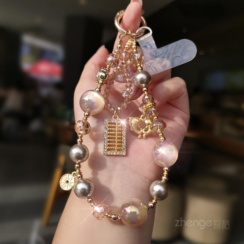 

Lucky gold beads crystal mobile phone lanyard ins boutique handmade beaded portable chain super beautiful outdoor travel can be carried lucky gold bead crystal bracelet