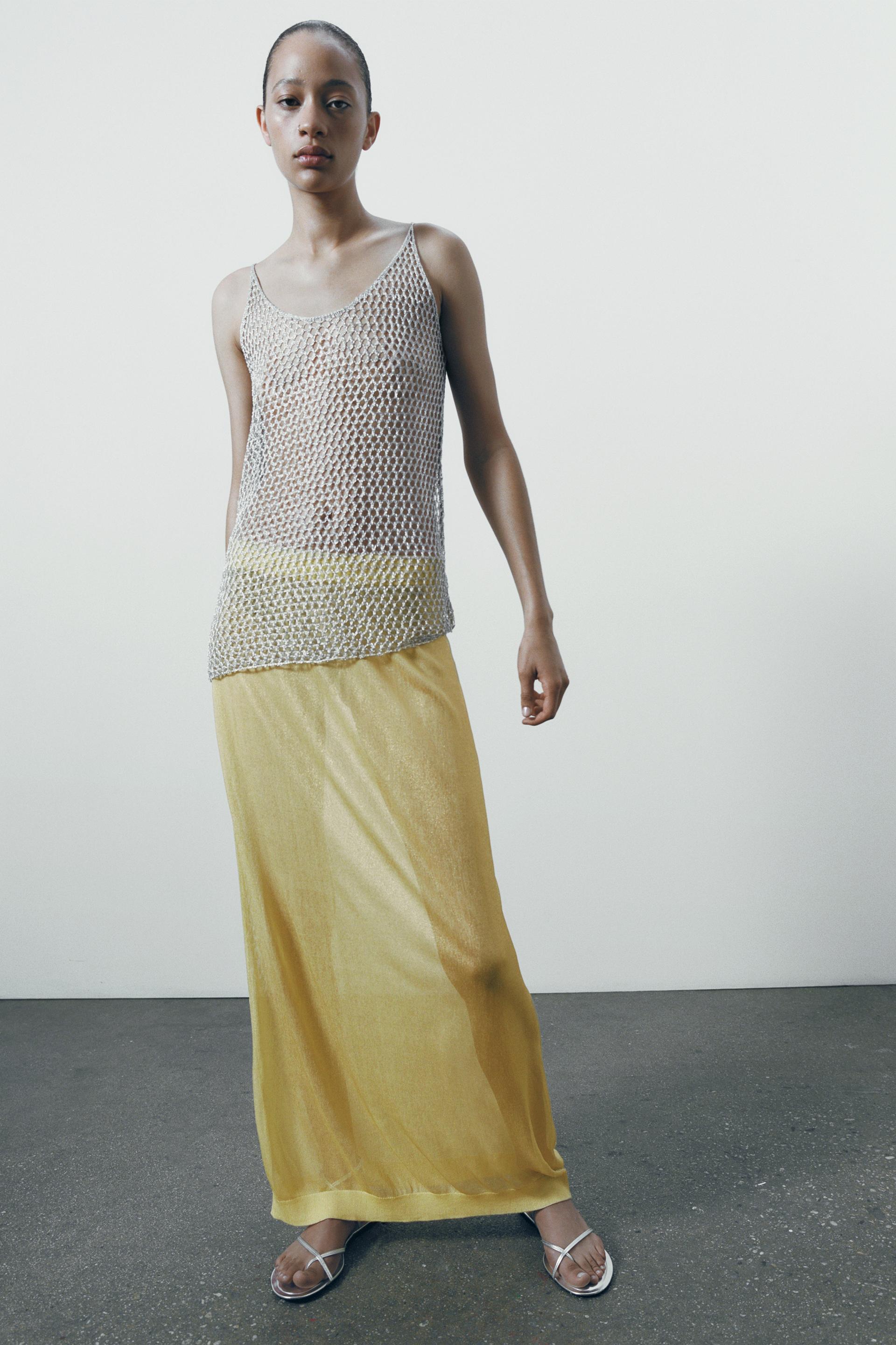 

ТРИКОТАЖНЫЙ ТОП С МЕТАЛЛИЧЕСКОЙ СЕТКОЙ