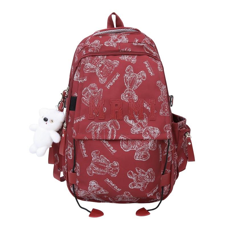 The new bear graffiti backpack has a large capacity of foreign style tide and a couple of middle and high school students have a class backpack tide.