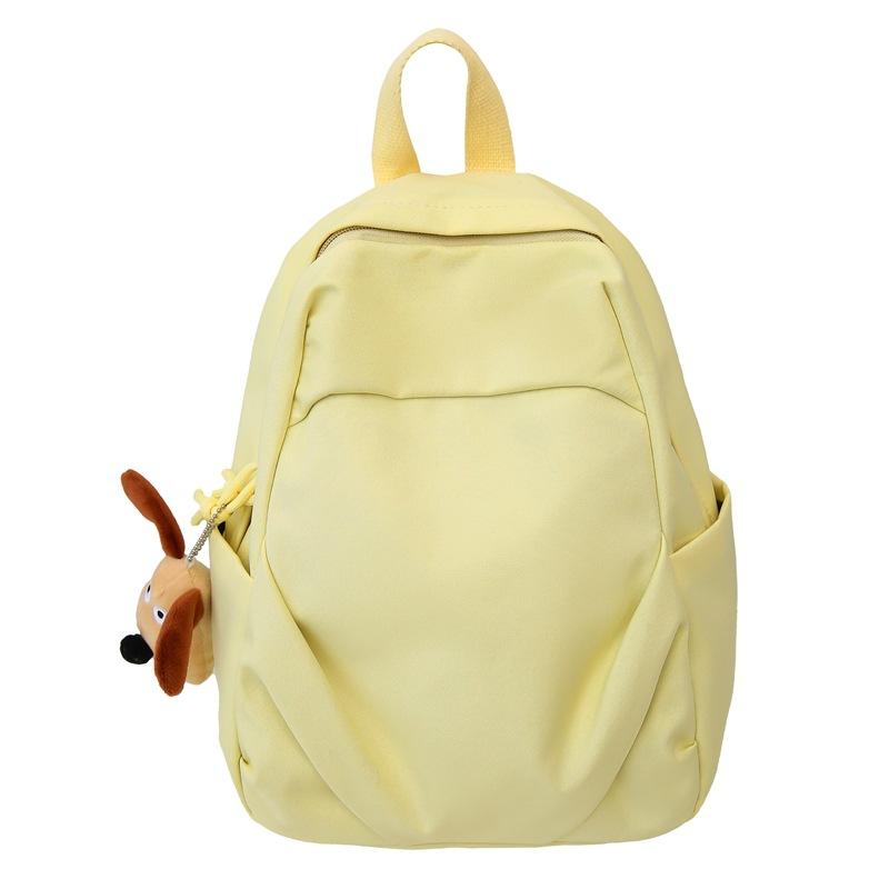 

Шкільний портфель молодшої школи. Жіночий однотонний рюкзак. Студентський маленький рюкзак жовтий
