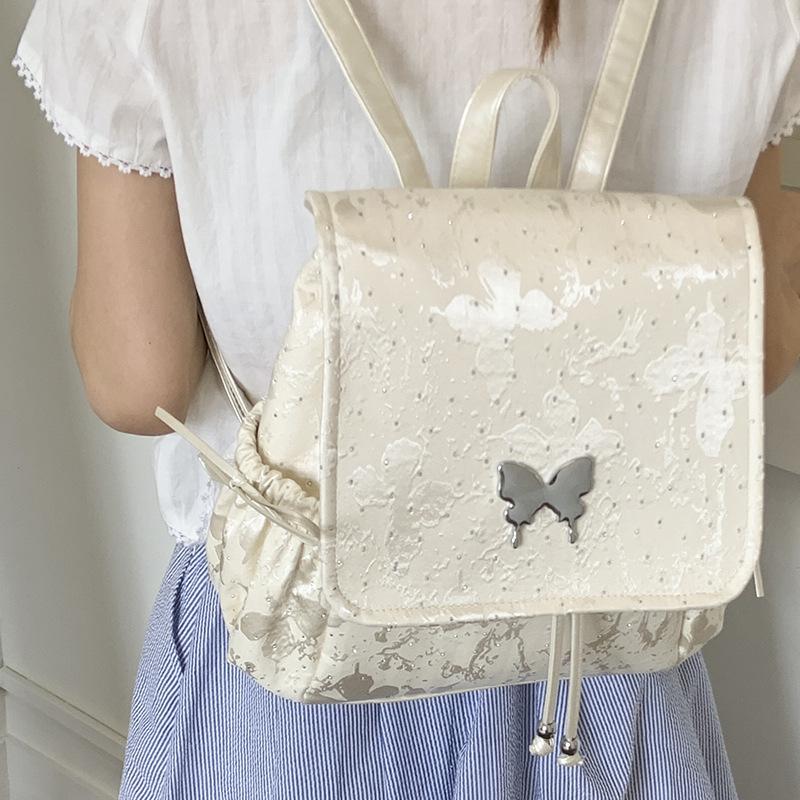 2025 new trendy silver butterfly backpack bag, student class backpack, hand-held travel bag, high-value bag.