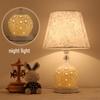 European Style Ceramic Bedside Lamp: Fashionable, Dimmable Night Light with Fabric Shade for Bedroom or Study.
