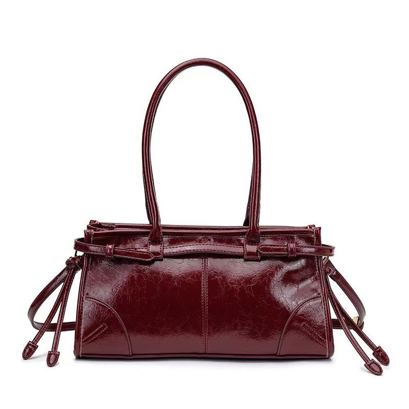 

Жіноча бордова шкіряна різдвяна сумка-багет: Модна сумка-кросбоді від інфлюенсера з французькою текстурою. 32 X 10 X 16 CM бордовий