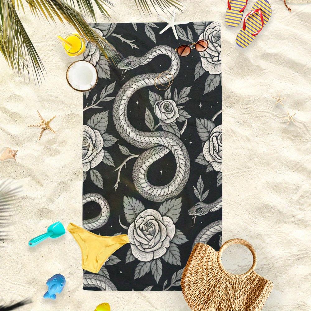 A Microfibre Black Beach Towel Featuring a Snake And Rose Design - Ideal for Summer Days by The Ocean, Fashionable And Absorbent