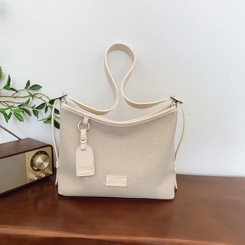 

Сумка большой вместимости женская новая нишевая холщовая сумка-тоут для通勤, высококлассная на плечо, сумка-мессенджер