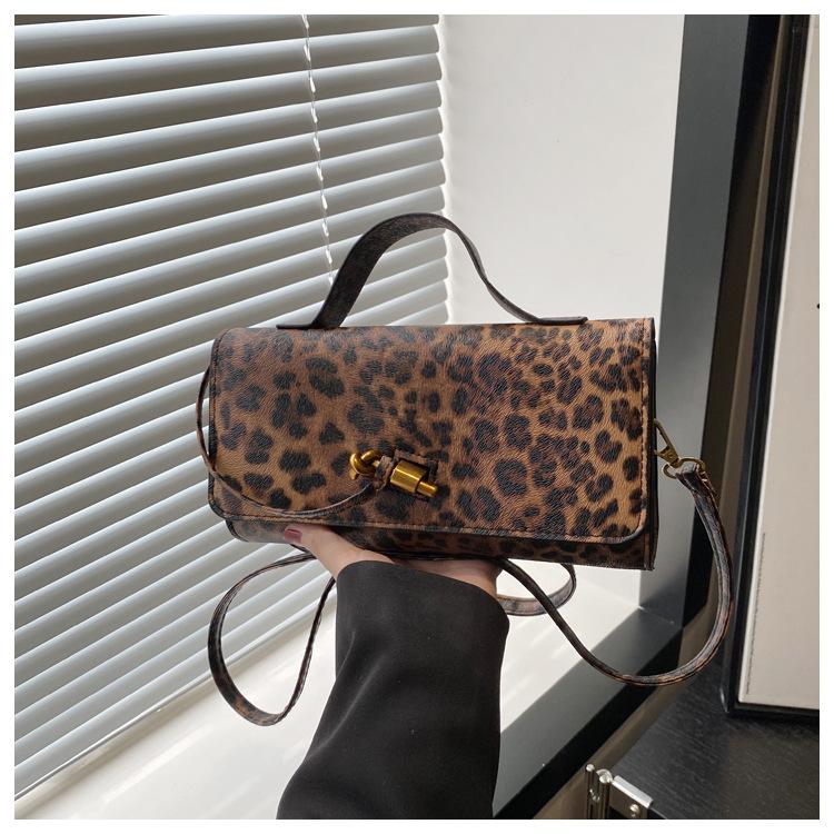 

Fashion exquisite weaving 2025 solid color casual lock large capacity foreign style horizontal cross shoulder baguette women s bag