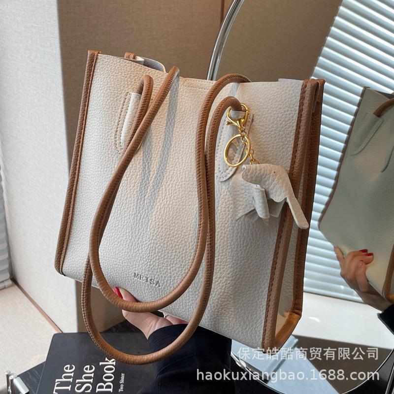 Large capacity bag women's summer 2025 new fashion mother and child bag high sense versatile commuter shoulder armpit tote bag