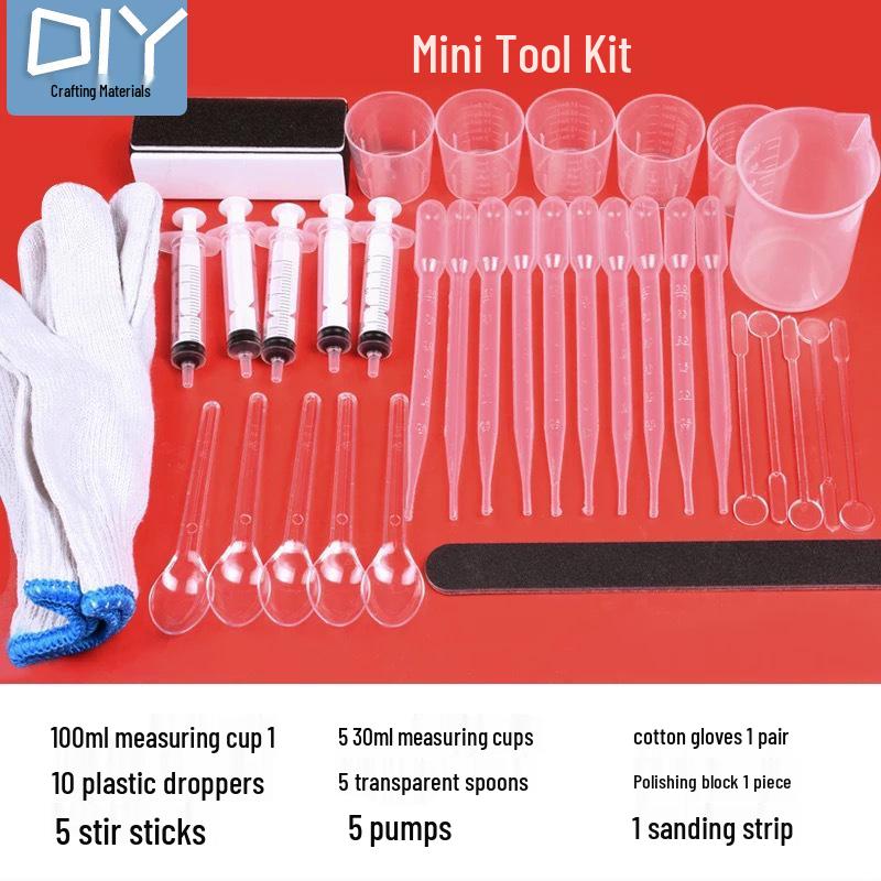 DIY Epoxid-Werkzeugset mit Handschuhen, Messbechern, Waage, Pinzetten, Tropfer, Schleifpapier, Politur und Stanze.