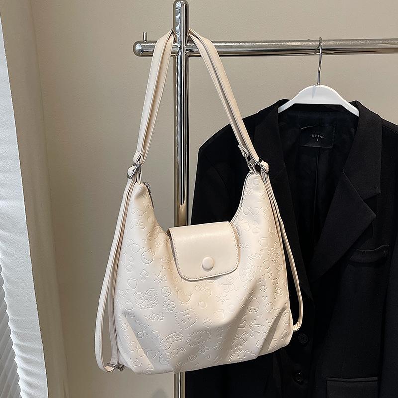 High-quality new niche cute graffiti embossed large-capacity tote bag light casual soft leather multi-back shoulder bag
