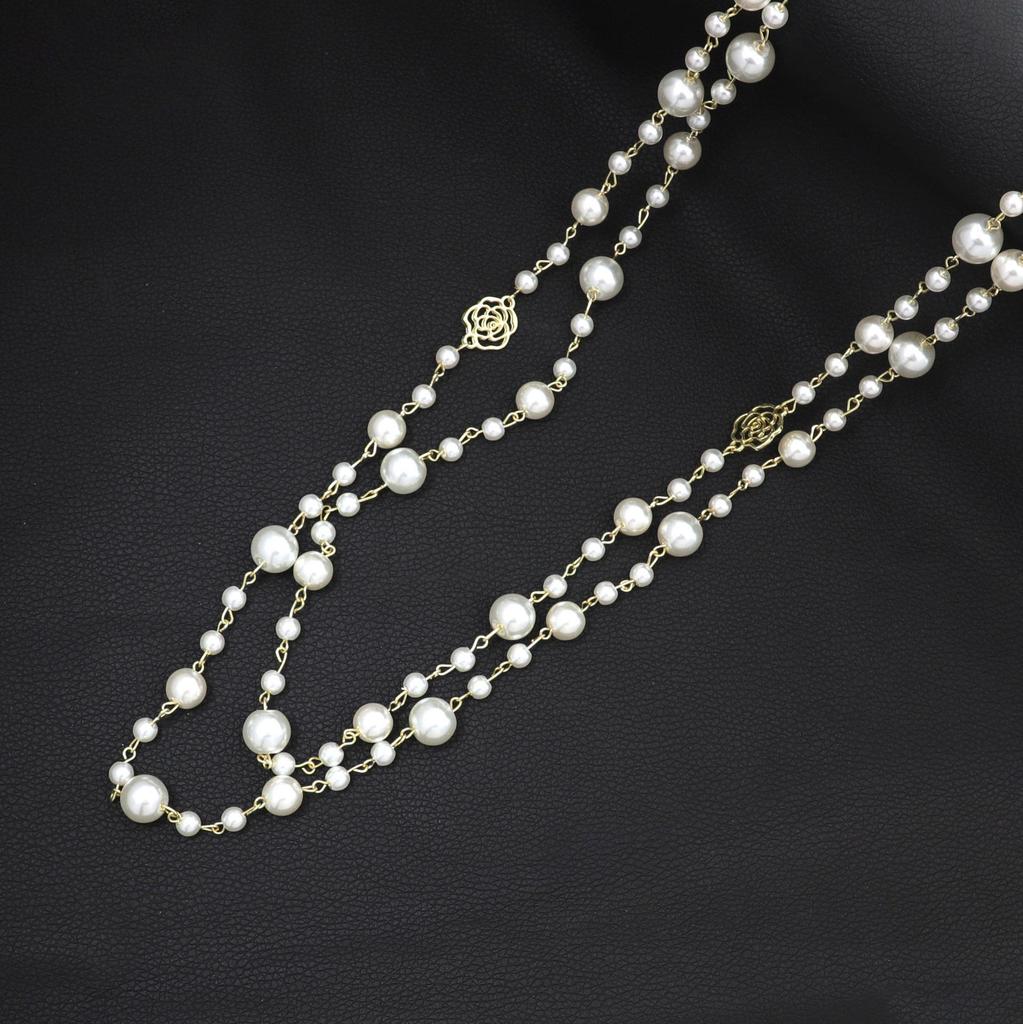 Korean Long Pearl Necklace: Trendy Multi-layer Hollow Flower Sweater Chain for Women