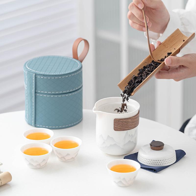 Flower travel tea set, light luxury and portable, one pot and four cups of Ru kiln car business gifts