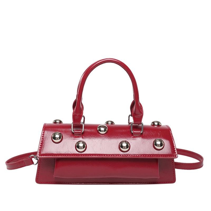 

Internet celebrity armpit bag 2025 new Korean version fashion rivet personalized handbag women shoulder messenger tote bag tide червоний