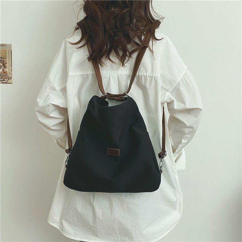 Große Kapazität Modische Canvas-Umhängetasche Damen Freizeit Literatur und Kunst Einfacher einfarbiger Umhängerucksack