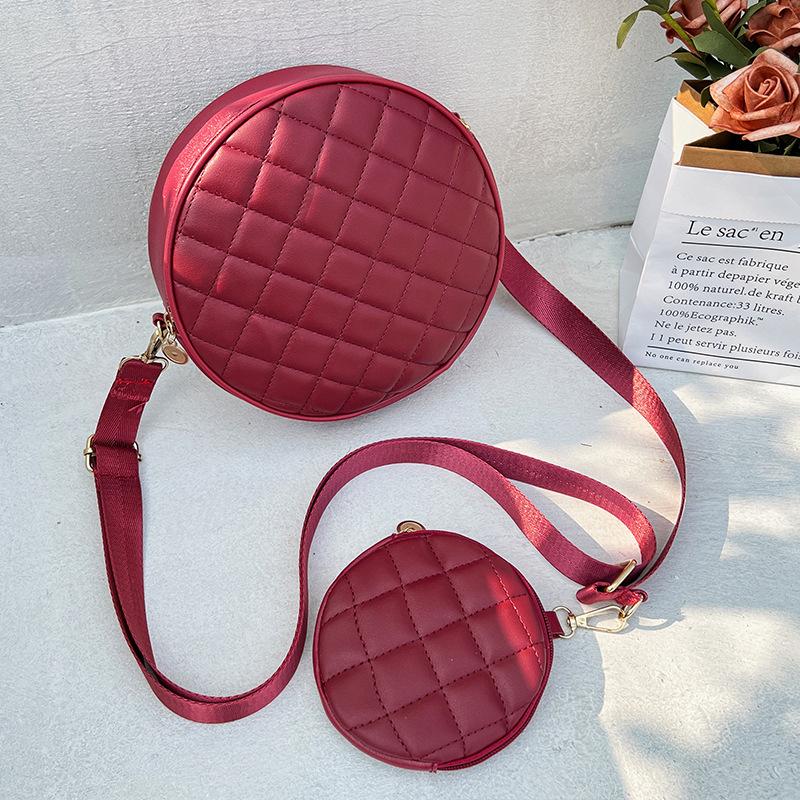 Bag women's new solid color rhombus embroidered messenger small round bag with change small bag fashionable one