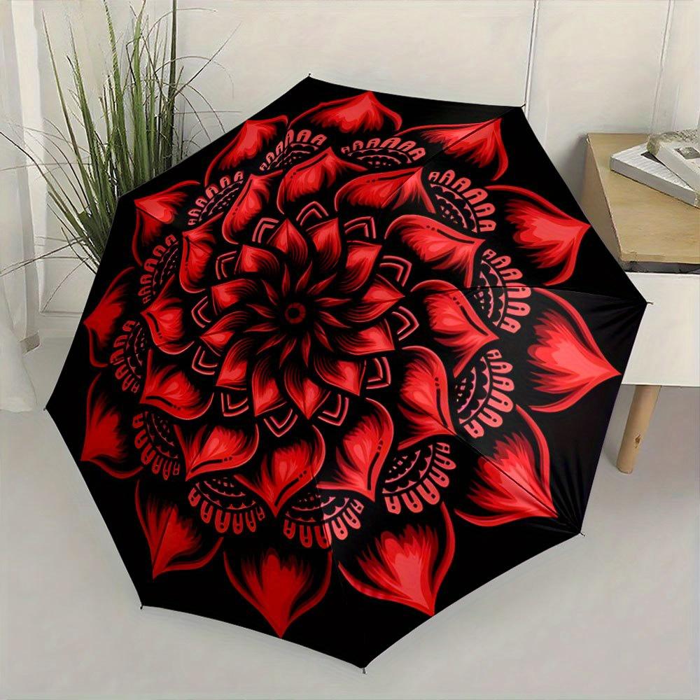 This Compact Umbrella Showcases a Lively Red Mandala Pattern with Petal Motifs Extending Outward from The Middle. Ideal for Tr