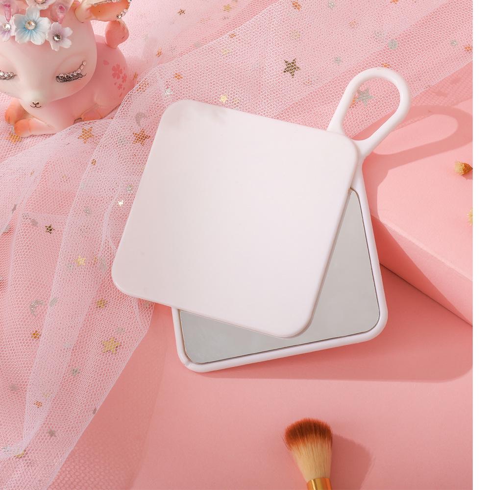 

Rotatable Handheld Single-Sided Cream Glue Mirror for Makeup, Dressing Table, or Business Gift 8*8 cm белый