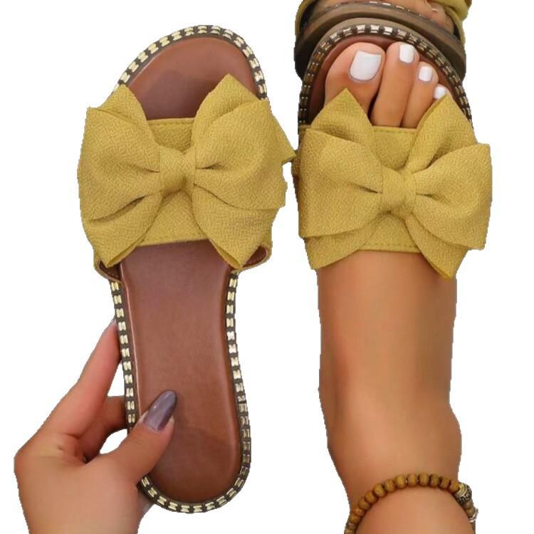 New flat-bottomed rhinestone bow one-word slippers for women to wear solid color light cloth cool slippers 2025