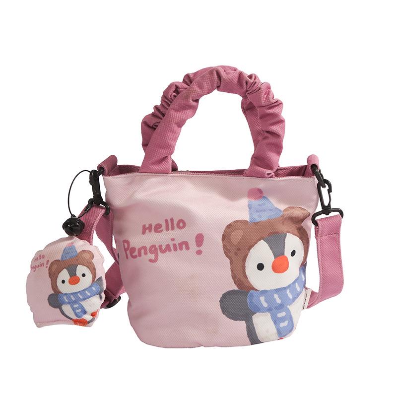 

Elegant Women s Canvas Handbag with Pendant, Versatile Bucket Design, Single Shoulder, and Crossbody Style.