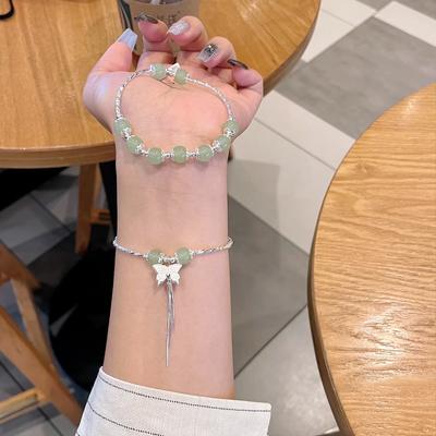 Neues Armband mit Schmetterlingsquaste im chinesischen Achat-Design