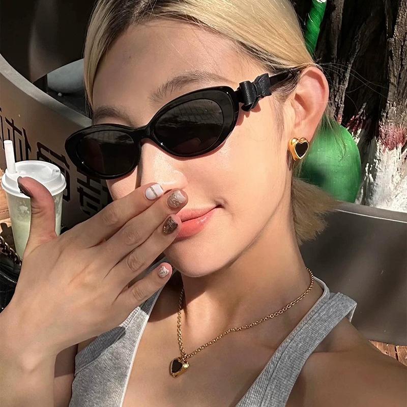 Fashion cat eye sunglasses bow decorative sunglasses women's high-end street photo UV-proof sunglasses