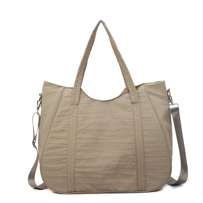 

Simple casual travel bag women s 2025 autumn new cotton clothing bag large capacity lazy wind shoulder tote bag хаки