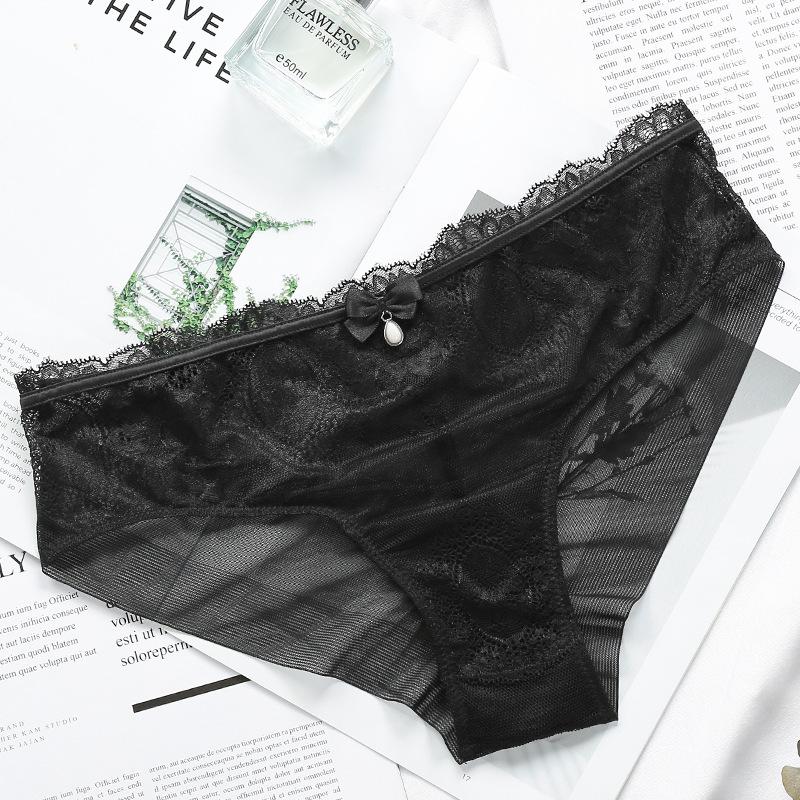 Ropa interior de encaje estilo europeo y americano con entrepierna de algodón ahuecada transpirable de talle medio para mujer