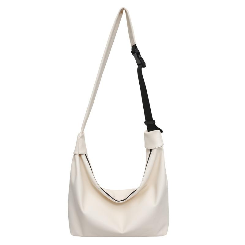 Simple, fashionable and large-capacity pu men's and women's locomotive commuter bags, new literary and versatile women's shoulder messenger bags