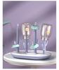 Versatile Baby Bottle Holder & Detachable Drying Rack with Pacifier Slot.
